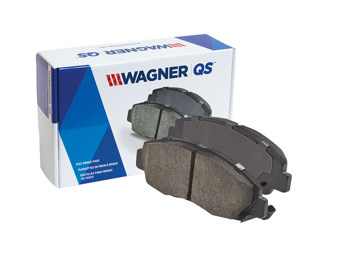 Two Wagner OEX brake pads in front of the box they came in