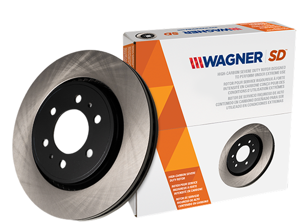 Two Wagner OEX brake pads in front of the box they came in
