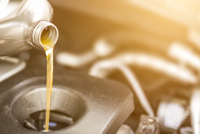 Pouring-Oil-Into-Car-Engine