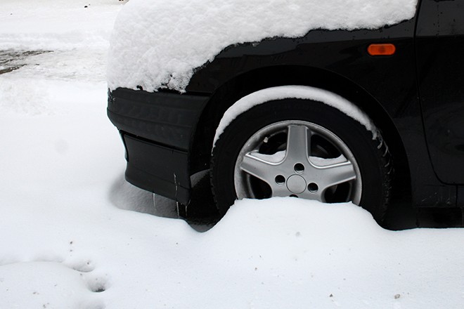 Car-Stuck-In-Snow-Close-Up-Of-Tire