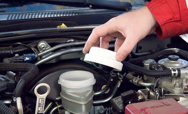 Checking-Brake-Fluid-Closeup Checking-Brake-Fluid-Closeup