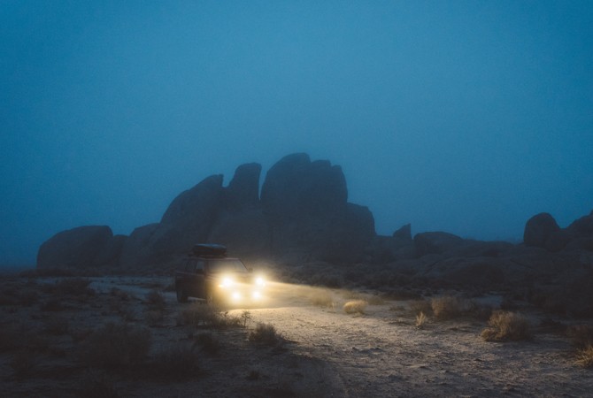 car-driving-on-Dark-road-with-lights-on