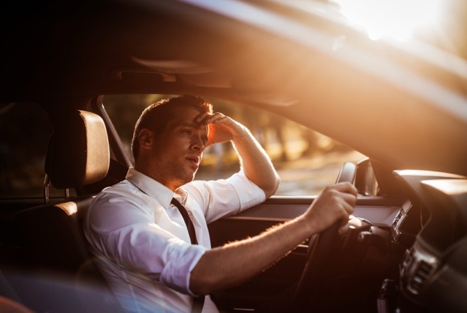 Man-Sitting-in-Car-Driver-Seat