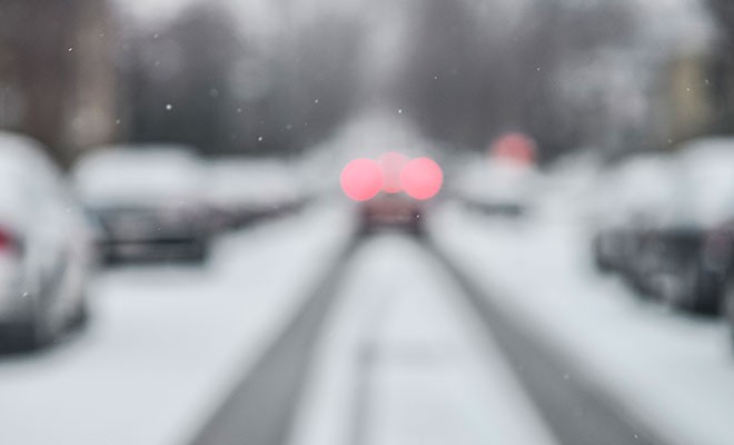 Car-With-Brake-Lights-On-Snowy-Road Car-With-Brake-Lights-On-Snowy-Road