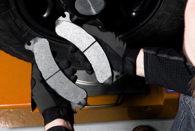 keep-light-commercial-vehicle-running-with-wagner-sd-brake-pads-2 Technician installion Wagner SD Brake Pads.